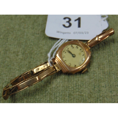 31 - 9ct gold ladies wristwatch having Arabic numerals.