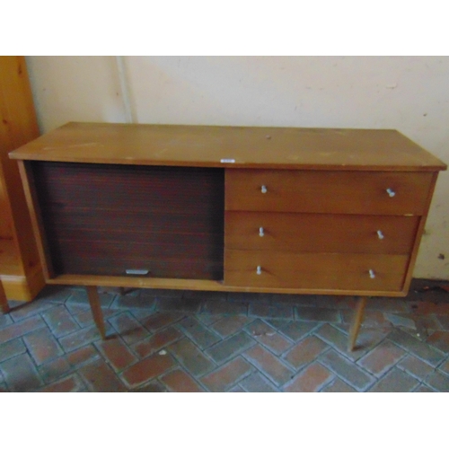 340 - Mid century teak tambour fronted side cabinet, having three drawers and on tapered supports. 30 x 49... 