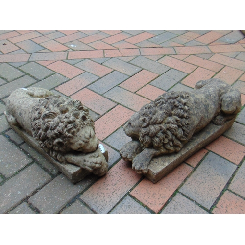 346 - Pair of stoneware garden statues modelled as recumbent lions, each 17