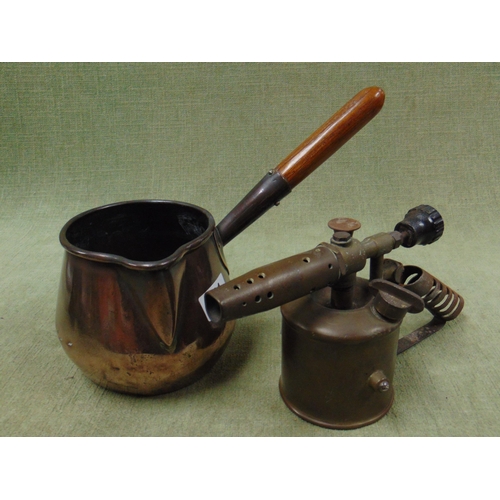 351 - Antique copper saucepan together with a brass blowtorch. (2)