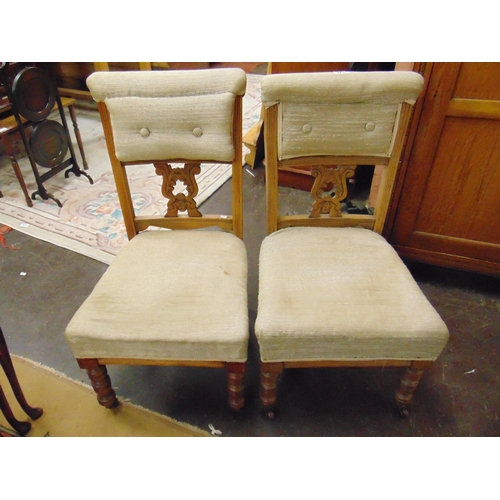 374 - Pair of shaped form beech framed nursing chairs, pierced splat backs and on turned frontal supports ... 