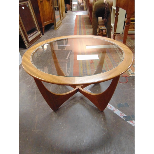 394 - G Plan Astro circular glass topped coffee table, set on shaped supports, 18 x 32