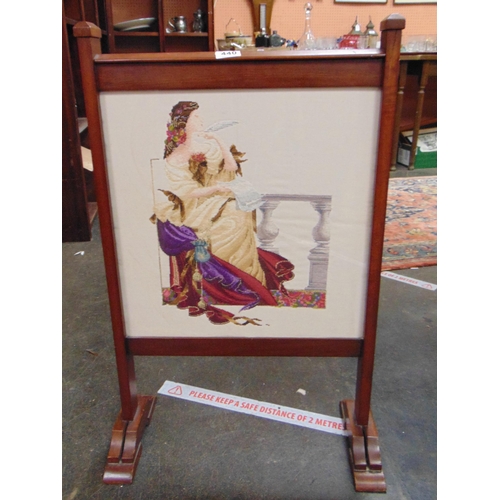 440 - Mahogany framed and glazed needle work fire screen, depicting classical lady. 32