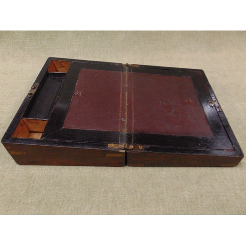 54 - Antique rosewood brass bound writing box, having lift up lid and fitted interior.