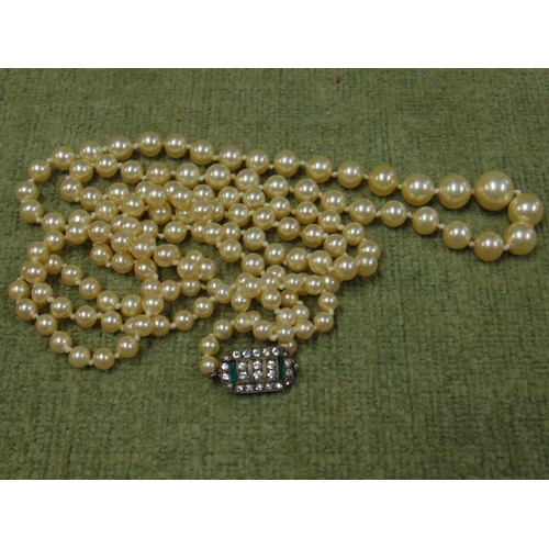 6 - Two string cultured pearl necklace, together with another single string example. (2)