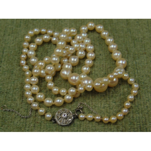 7 - Single string cultured pearl necklace, having 9ct gold clasp and one other example.