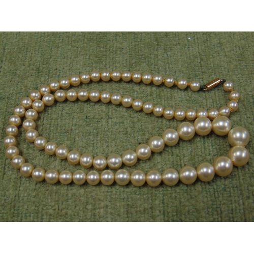 7 - Single string cultured pearl necklace, having 9ct gold clasp and one other example.