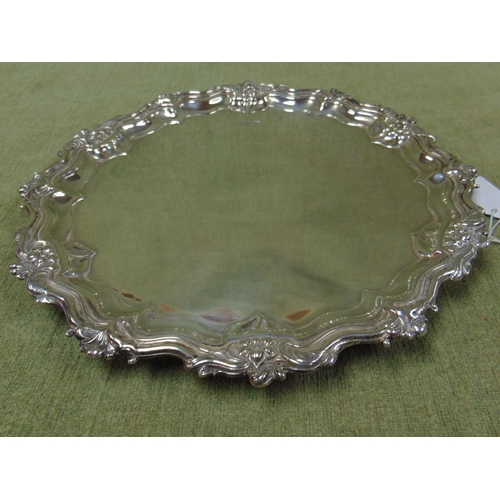 1 - Silver salver of shaped form and having embossed floral decoration, maker Walker & Hall, Sheffield 1... 