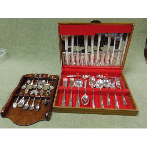 100 - Cased canteen of plated cutlery and some collector's spoons.