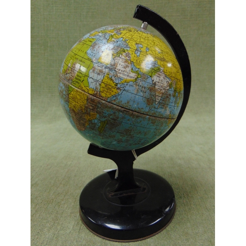 133 - Small tin plate terrestrial globe on stand. 8.5