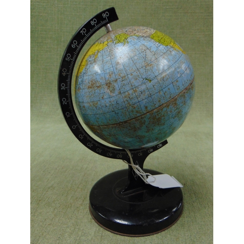 133 - Small tin plate terrestrial globe on stand. 8.5