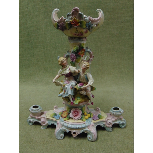 145 - Antique continental candle holder, having floral and gilt decoration, moulded figural lovers. 12