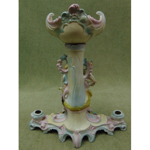 145 - Antique continental candle holder, having floral and gilt decoration, moulded figural lovers. 12