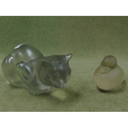 148 - Lalique glass model of a crouching cat (af) together with a glass duck figure. (2)