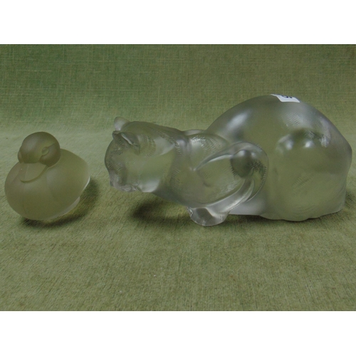 148 - Lalique glass model of a crouching cat (af) together with a glass duck figure. (2)