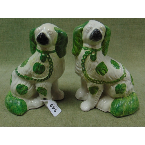 149 - Pair of 19th century Staffordshire green and white coloured spaniels, each 9.5