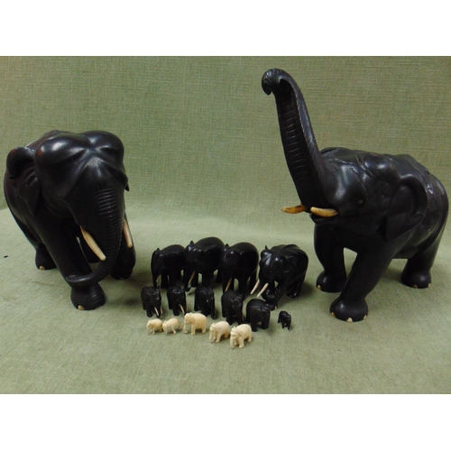 15 - Large pair of ebony elephant figures and some smaller figures.