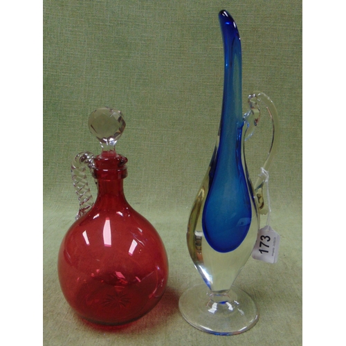 173 - Studio glass jug together with a Cranberry glass decanter. (2)