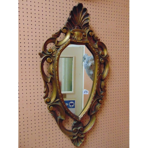 279 - Ornate gilt framed wall mirror.32 x 16