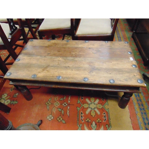 291 - Metal bound coffee table, together with a pair of leather effect chairs.