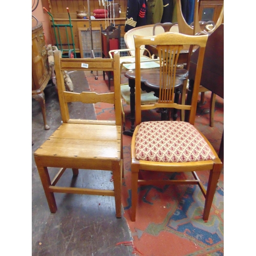 300 - An oak country made chair and one other.(2)