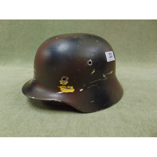 33 - World War II German steel helmet.