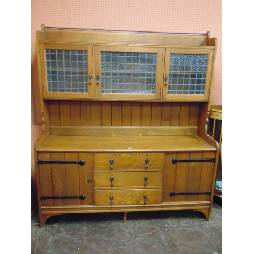 333 - Oak Arts and Crafts influenced dresser, upper section with leaded glazed panels enclosing a shelf li... 