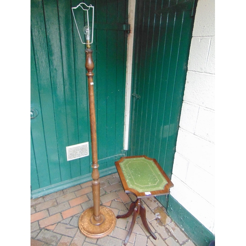 380 - Green leather topped occasional table and a standard lamp. (2)