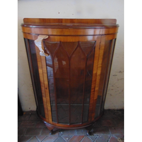 392 - Walnut veneered bow fronted display cabinet, raised back, single door, shelf lined interior and on s... 