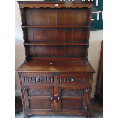 393 - Reproduction oak dresser, plate rack back with drawers and cupboards to base. 68 x 42 x 17