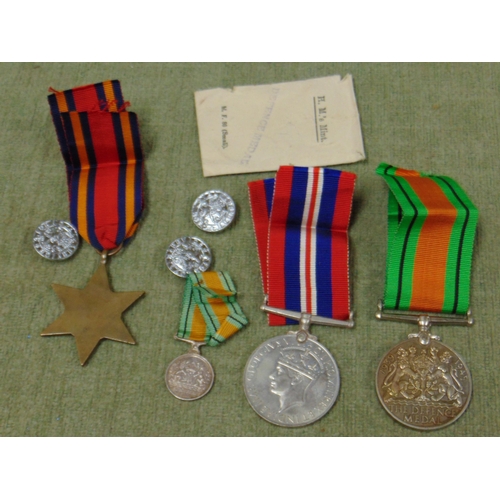 72 - Second World War defence medal with paper work, War medal, Burma Star and miniature defence medal.