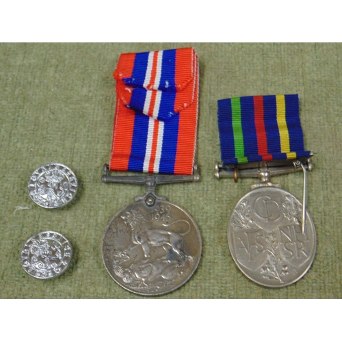 77 - 2nd World War medal together with a QE2 Territorial and volunteer medal.