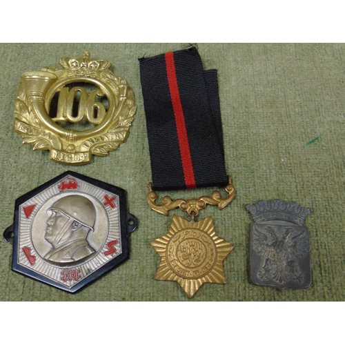 89 - Collection of foreign badges and a medal.