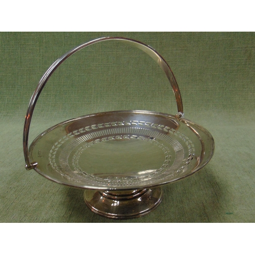 92 - Silver sweet meat dish, having swing handle and on footed base, maker William Hutton & Sons, Birming... 