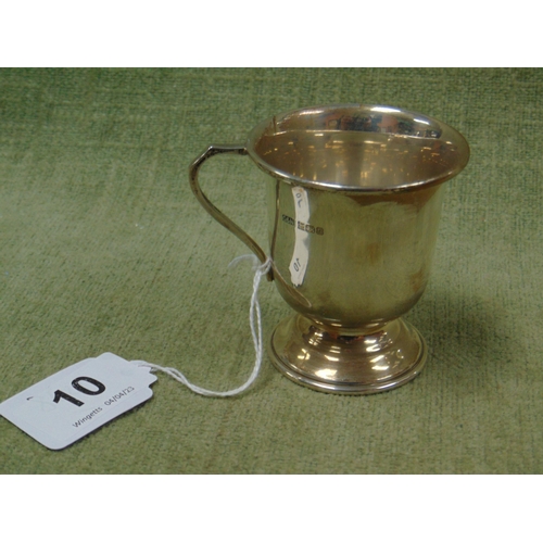 10 - Silver christening mug, having loop handle and on footed base, maker Crisford & Norris Ltd Birmingha... 