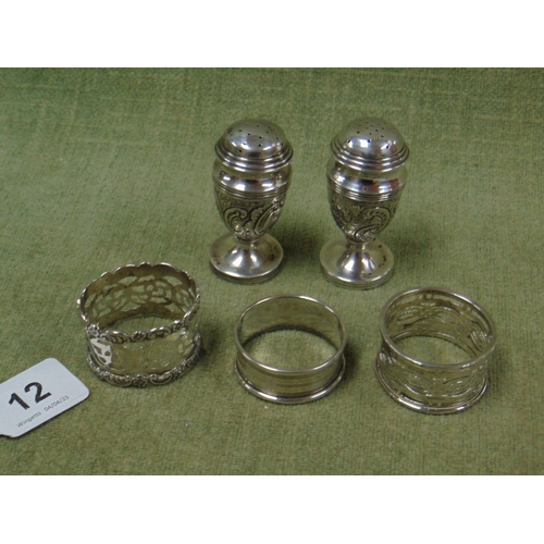 12 - Pair of silver pepper pots, maker Thomas Hayes , Birmingham 1898, together with three silver napkin ... 