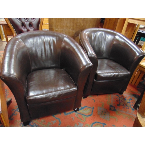 345 - Pair of brown leather tub chairs.