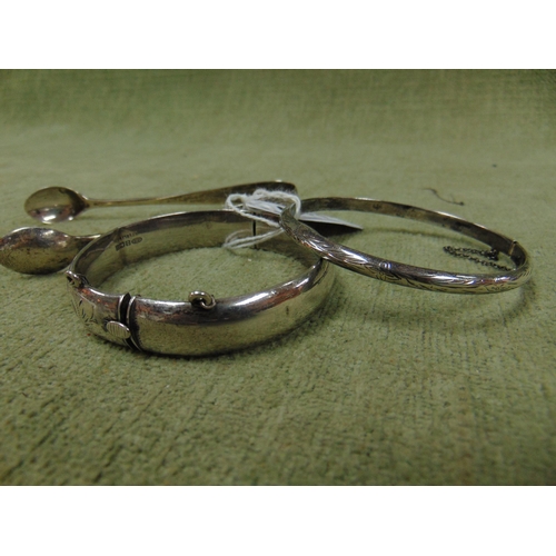 449 - Silver bangle, pair of silver sugar tongs and a bracelet marked 925, (3).