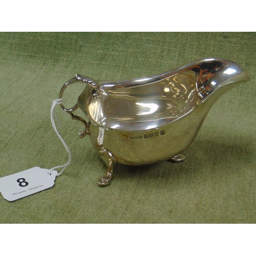 8 - Silver sauce boat, having scroll handle and on pad feet, maker Jewellery and metal manufacturing Co.... 