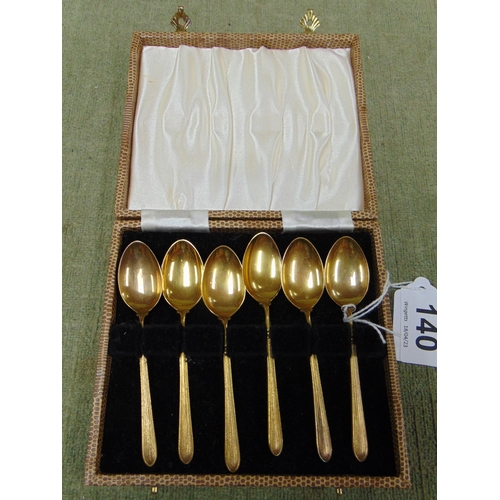 140 - Cased set of six European gilded teaspoons.