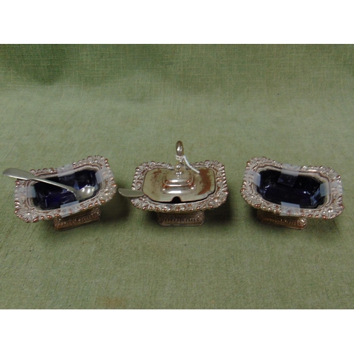 149 - Two silver plated salts having blue glass liners and one other. (3).