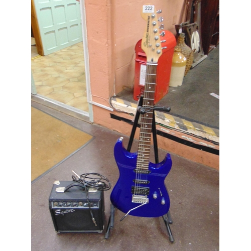 222 - Squire Showman electric guitar on stand, together with an amp.