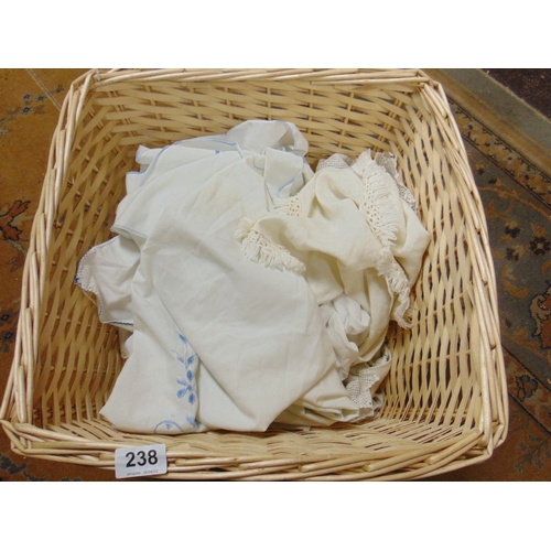 238 - Wicker basket, containing a quantity of linen.