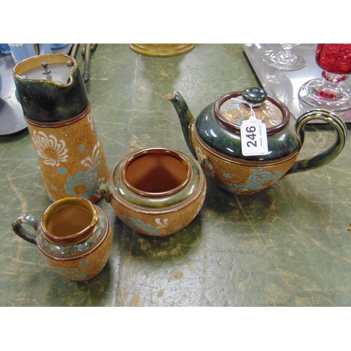 246 - Doulton Lambeth teapot, milk jug, similar sugar bowl and a hot water jug. (4)