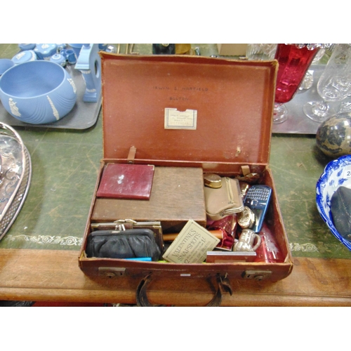 247 - Small suitcase containing a collection of trinkets.