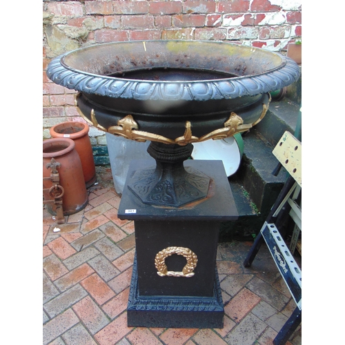 301 - Impressive cast iron painted garden urn on stand, having gilt highlights. 45 x 32