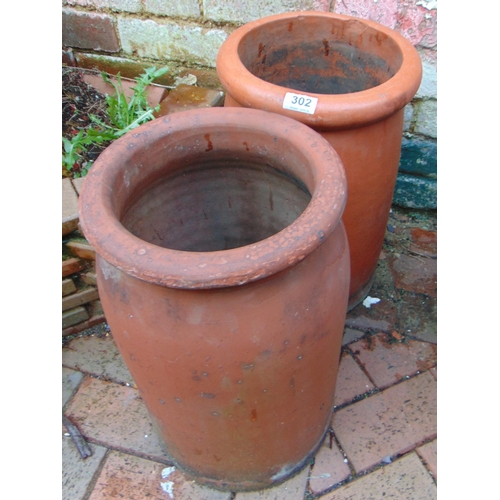 302 - Two teraccotta chimney pots, each 18