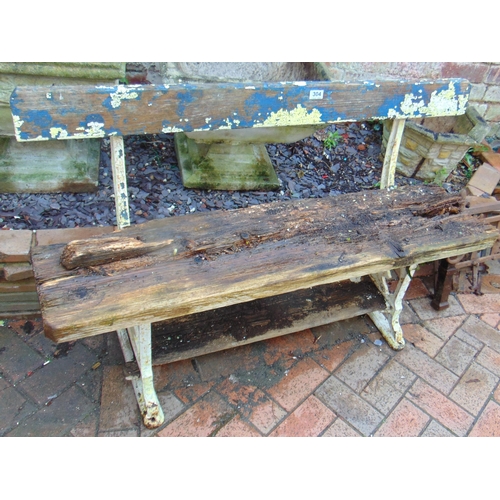 304 - Wooden slatted garden bench, having cast iron ends, for restoration. 48