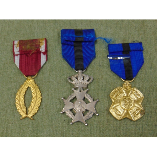 58 - Belgium order of Leopold II medal and two others.