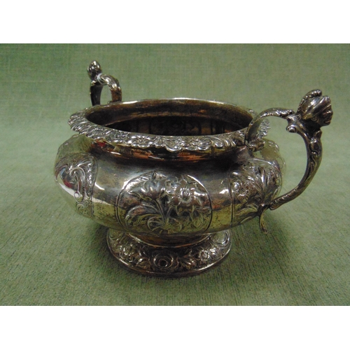 24 - Antique London silver two handled sugar bowl, having Britania mask finials and embossed decoration. ... 